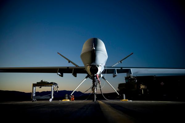 A picture of a drone plane parked on the ground.