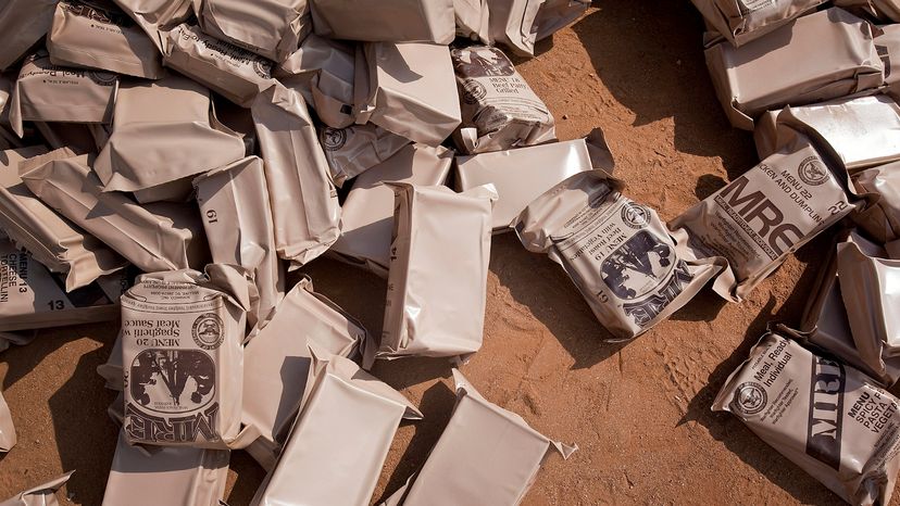 A pile of Meals Ready to Eat (MREs) lies on the floor at an Armed Force for the Defense of Mozambique