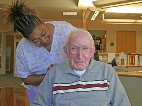 male resident of nursing home with aide