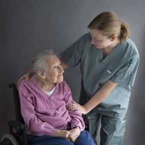 An elderly woman and her caregiver