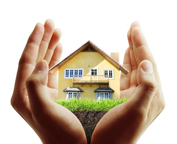 Hands holding a home and lawn