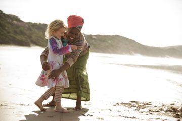 Two people embracing in a childhood outdoors adventure.