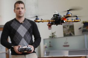 MIT graduate student Daniel Soltero demonstrates the use of a quadrotor inside the MIT Computer Science and Artificial Intelligence Laboratory. The nano quadrotor is a much smaller version of this.See robot pictures.