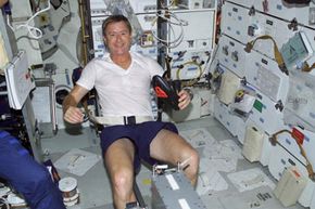 astronaut exercising in space