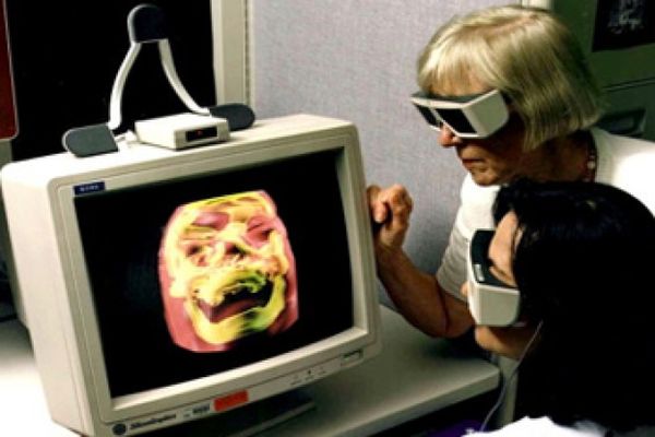 Doctors work with a high-resolution 3D image of a human skull at the NASA Ames Research Center in 1998.  