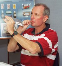 Astronaut Brian Duffy, STS-92 mission commander, samples an orange drink.