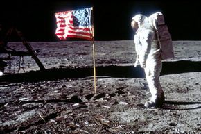 Astronaut Buzz Aldrin posing next to the U.S. flag on the moon