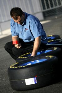A crew member works on tire air pressure during testing at Daytona International Speedway in Daytona Beach, Fla.