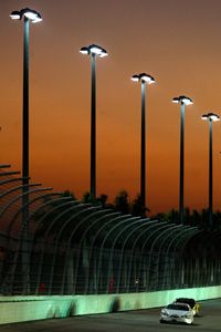 NASCAR drivers race as the sun sets in Homestead, Florida.