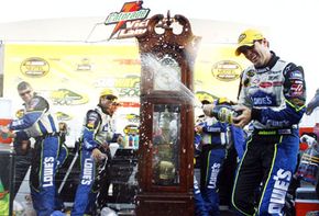Jimmie Johnson sprays champagne on his crew after his victory in the NASCAR Nextel Cup Series Subway 500 in October 2006 in Martinsville, Va.