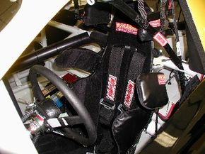 The seat in a NASCAR race car: Note how it wraps tightly around the driver's ribs and shoulders. See more NASCAR pictures.