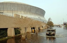 A National Guard Humvee departs the New Orleans Superdome in Louisiana after Hurricane Katrina