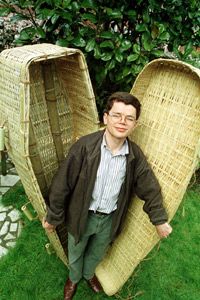 The designer of an eco-friendly bamboo coffin shows off his wares at the Natural Death Centre in North London.
