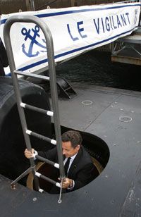 President Nicolas Sarkozy of France boards Le Vigilant, a nuclear-powered submarine, on July 13, 2007, during his visit to the Ile Longue Defence, a French navy base.