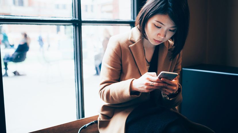 woman looking at smartphone