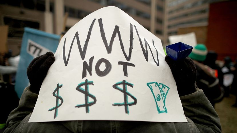 Demonstrator protesting net neutrality rules being overturned