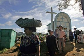 People visit the tombs of their relatives during All Saints' Day celebrations.