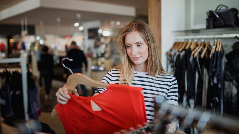 Woman browsing in clothes story