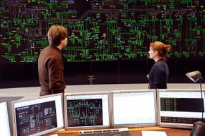 Technicians monitoring electricity consumption on a power grid in France. 
