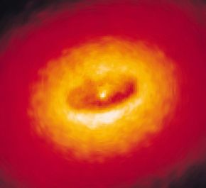 A giant disk of cold gas and dust See more black hole images.