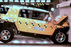 This handout photo provided by The National Highway Traffic Safety Administration, shows a crash test of a 2007 Toyota FJ Cruiser.