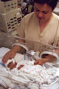NICU nurse with baby