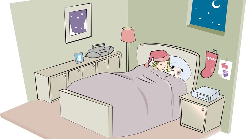child sleeping in bed with stocking