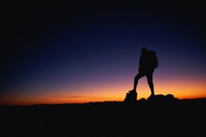 hiker observing sunset