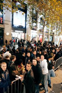 People wait in front of a store inParis for the Wii to go on salein December 2006.