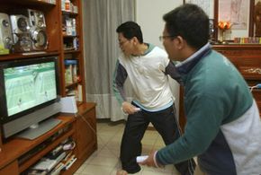 Two men in Taiwan test out the Wii in March 2007.