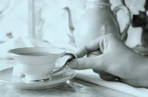 hand holding teacup