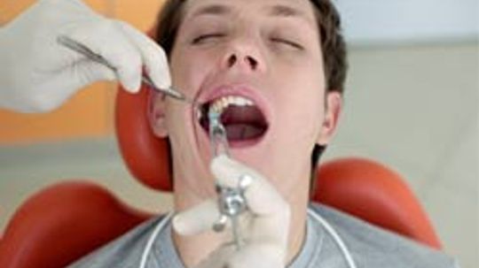What is a cavity in a tooth? Why do they drill it?