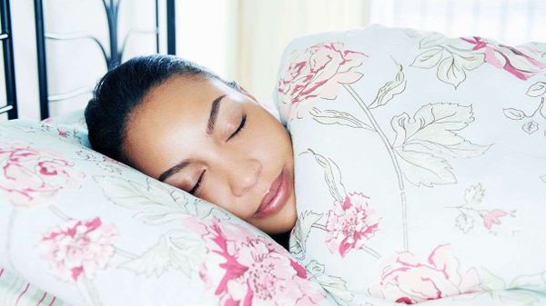 woman sleeping in pretty bed