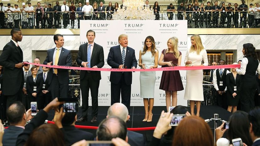 Donald Trump (C) and his family cut the ribbon at the new Trump International Hotel on Oct. 26, 2016, in Washington, D.C. The Trump Organization was granted a 60-year lease to the historic building by the federal government before the billionaire New York real estate mogul announced his intent to run for president.  Chip Somodevilla/Getty Images
