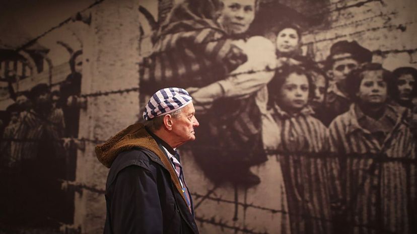 Holocaust survivor Igor Malicky, 90, pauses as he tours an exhibition inside the former German death camp Auschwitz ahead of commemorations in 2015 marking the 70th anniversary of the camp's liberation. Christopher Furlong/Getty Images