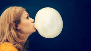 Woman blowing bubble