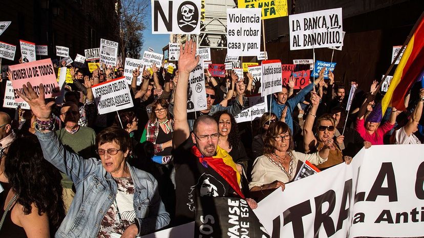 Protesters in Spain march in April 2017 against government corruption. Marcos del Mazo/LightRocket/Getty Images