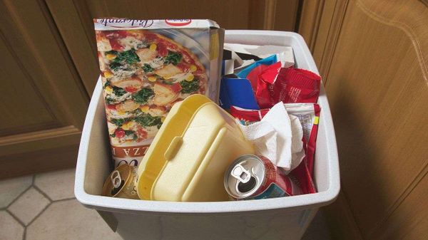 pizza box, soda can, garbage bin