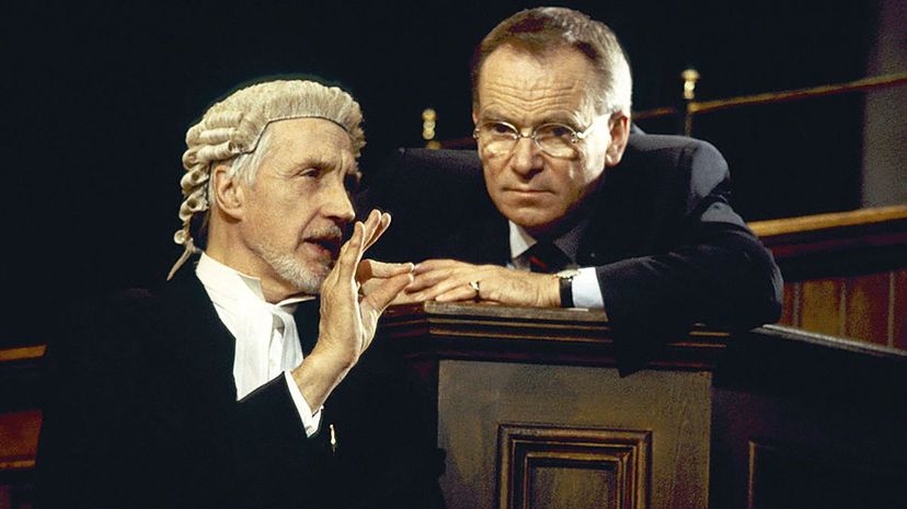 The actors Jeffrey Archer and Edward Petherbridge act in a 2000 stage production of "The Accused." Graham Wiltshire/Getty Images