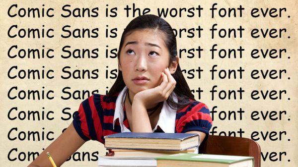 comic sans font with girl sitting at desk