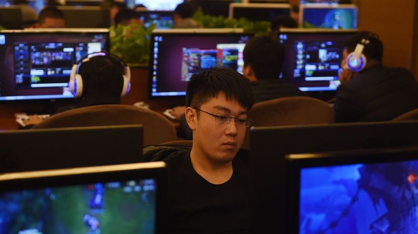 Men play games on computers in an internet bar in Beijing. 'Freedom and order' are both necessary in cyberspace, Chinese President Xi Jinping said on Dec. 16, 2015, as he opened a government-organised internet conference condemned by campaigners as an ... GREG BAKER/AFP/Getty Images
