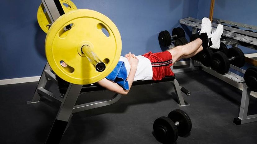 Man chilling on weight bench