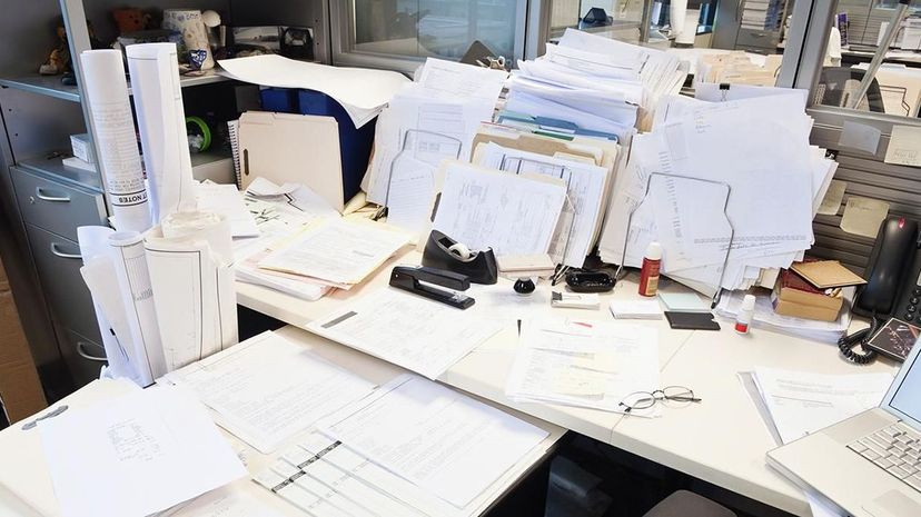 Is your cluttered desk a sign of creative genius or total chaos? Experts weigh in. Jetta Productions/Getty Images