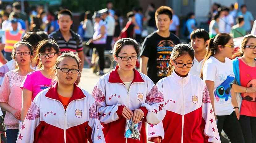 Chinese students leave school after finishing their college entrance exams. In China, some 90 percent of high school students are nearsighted. Zhang Peng/LightRocket via Getty Images