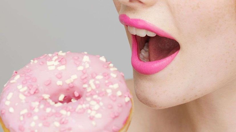 woman eating doughnut