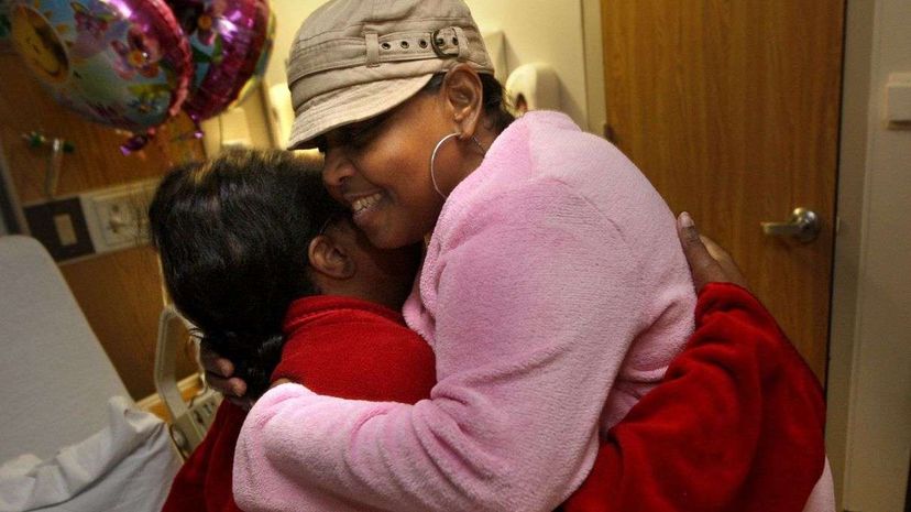 Edwina Jones (right) embraces her kidney donor LeQuenes Smith as they both recover from the kidney transplant surgery at Methodist Hospital. Smith donated a kidney to Jones.  Nikki Boertman/ZUMA Press/Corbis