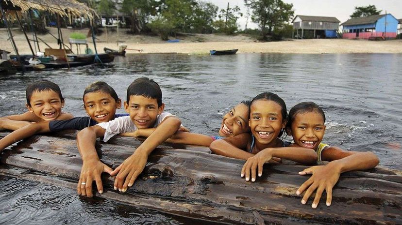 Amazonian children play in the Rio Negro in the northwestern part of Brazil where Nheengatu is spoken. Timothy Allen/Getty Images