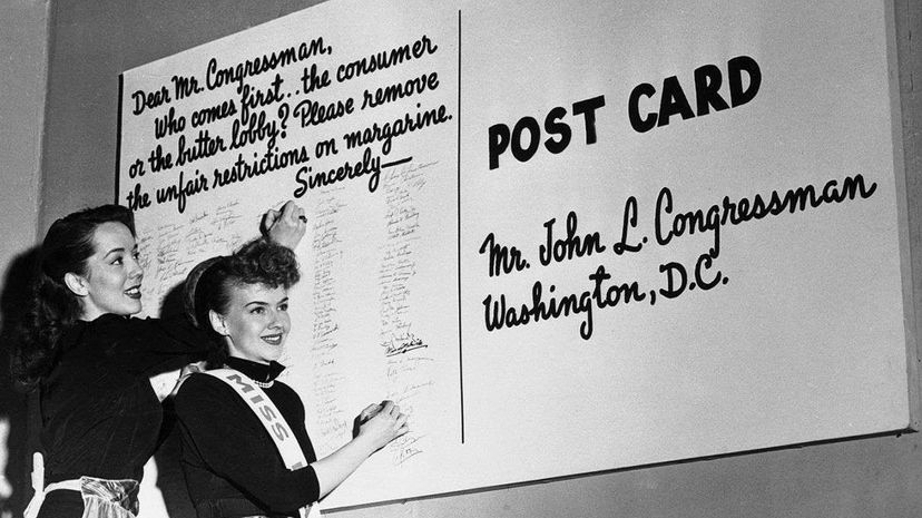 Canadians weren't the only ones indignant about the tax on margarine. In this photo, Lisa Kirk (left), a Broadway star, and Millicent Coleman named "Miss Margarine" add their names to a petition to Congress urging removal of restrictions on the sale of...  Bettmann/CORBIS