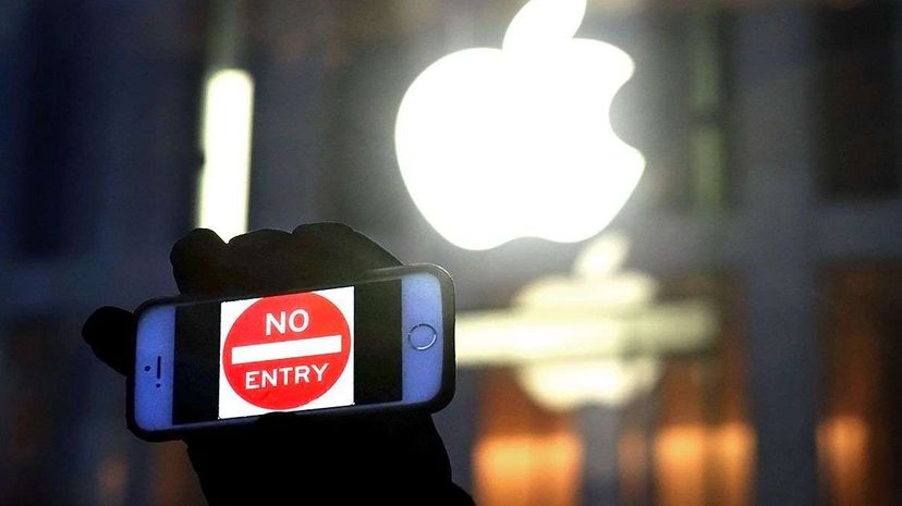 A man holds up an iPhone displaying a 'No Entry' image as part of a rally in front of an Apple Store in support of the company's privacy policy. Ultimately, the FBI unlocked the San Bernardino terrorists phone without help from Apple. Jewel Samad/AFP/Getty