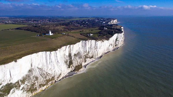 Beautiful coastal landscape with cliff and water.